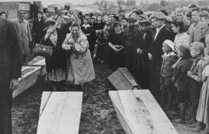  Mourners in Kielce, Poland, gather around coffins after townspeople killed 42 Jews in an antisemitic rampage in 1946.