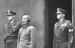 Matsui Iwane stands on trial at the War Crimes court, receiving his death sentence from the court.