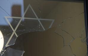 A broken window is seen at the center of the Jewish community in Rostock, Northern Germany