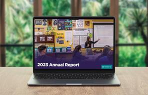 2023 Annual Report graphic on laptop.