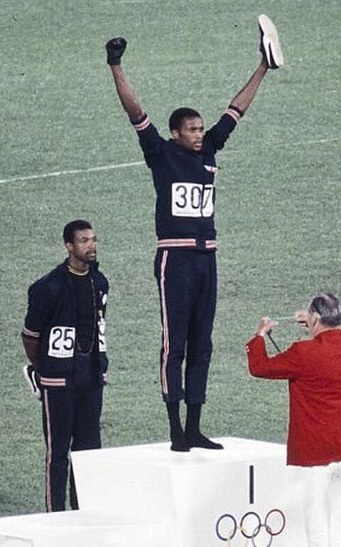 Photo of Tommie Smith on the Olympic podium first place