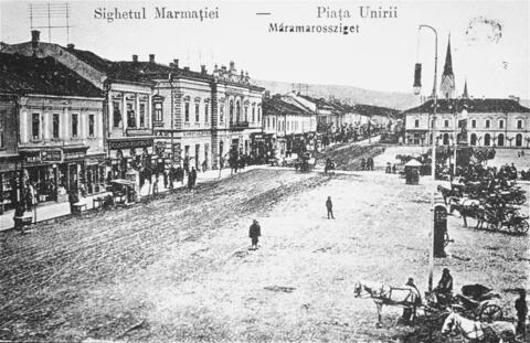 Black and white drawing of town square in Sighet, Romania. Depicts pre-World War II Sighet.